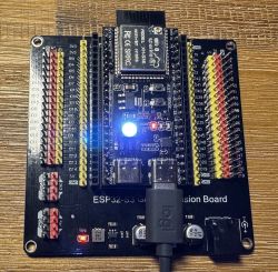 ESP32-S3 on GPIO expansion board with bright white RGB LED illuminated