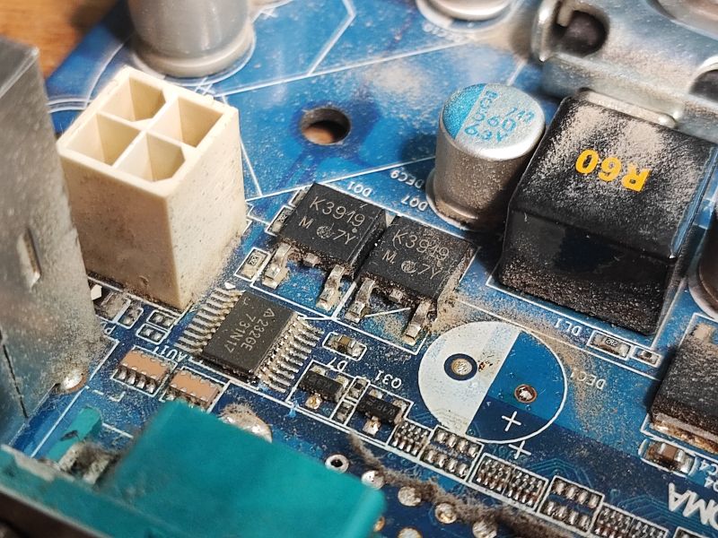 Old Motherboard Featuring K3919 Transistors Close-up of an old motherboard with electronic components K3919 and others.