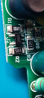 Close-up of a circuit board with several resistors and transistors.