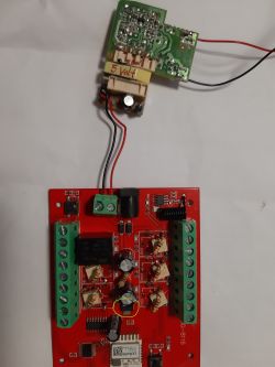 Circuit board with electronic components and wires.