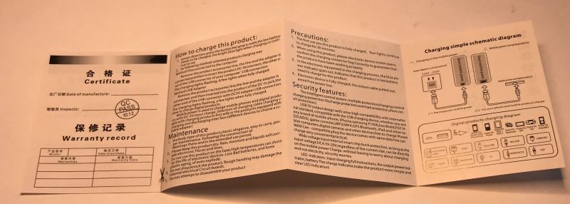 Open power bank manual with English and Chinese text plus charging diagrams