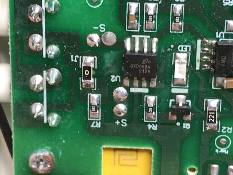 Printed Circuit Board with Electronic Components of a Wireless Doorbell Close-up of a printed circuit board with visible electronic components