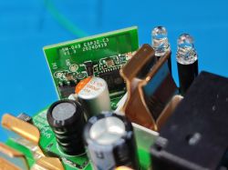 Inside the Sonoff S60TPG Plug – SM-049 ESP32-C3 Module Close-up of the internal PCB of a Sonoff S60TPG plug, showing the SM-049 ESP32-C3 module and electronic components.