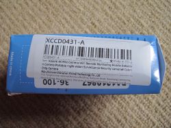 Label on Xiaomi 4K Mini Camera packaging Blue box with a white label showing a barcode and description of a Xiaomi 4K Mini Camera.