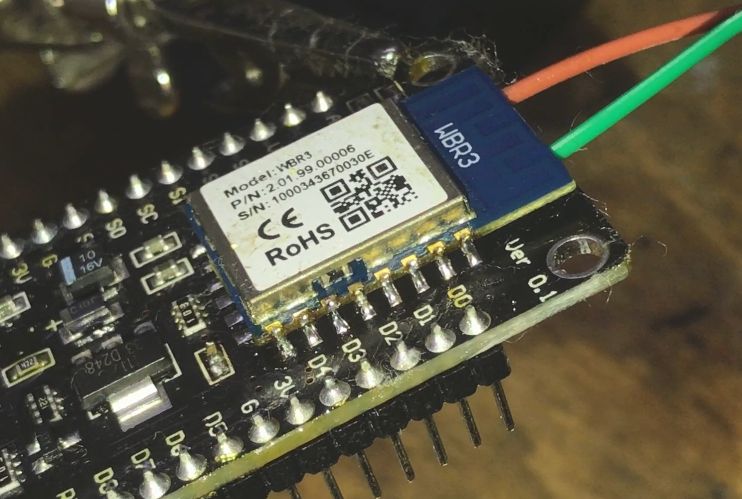 WBR3 module soldered onto a board using two wires.