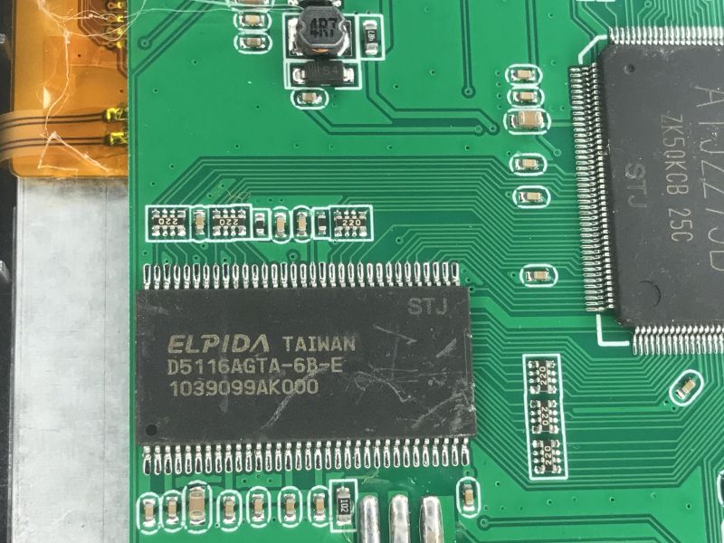 Close-up of a PCB showing Elpida D5116AGTA-6B-E chip and surrounding SMD components