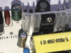 Inside the LED Panel with Visible Heatsink and Capacitors Close-up of electronic components inside an LED panel