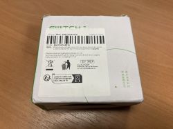 Smart light switch packaging with product information and a barcode.