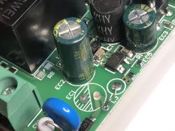 Electronic Components on a Circuit Board Close-up of a relay circuit board with visible electronic components.