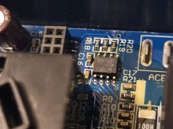 IC and SMD components on a printed circuit board Close-up of an integrated circuit and SMD components on a blue PCB