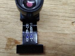 Camera module with lens and ribbon labeled KXP-STP-Z30 2020v1.0
