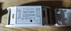 Wi-Fi smart switch with cover removed, revealing ESP8285 module.