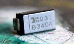 Close-up of a B340A SMD diode on a circuit board surface