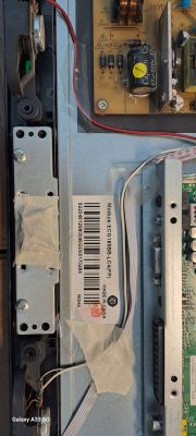 Interior of a television showing components and a part number label.
