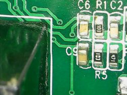 Close-up of a circuit board with markings C6, R1, C2, and SMD components.