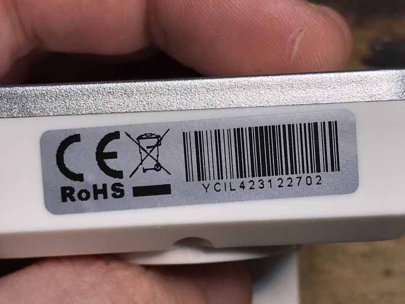 Label with CE and RoHS Certifications Close-up of a label with CE and RoHS certifications and a barcode.