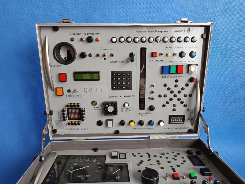 Voyager 3 Control Panel Toy in a Suitcase Handmade educational toy: a control panel with many buttons, LEDs, displays, and indicators, mounted in a suitcase.