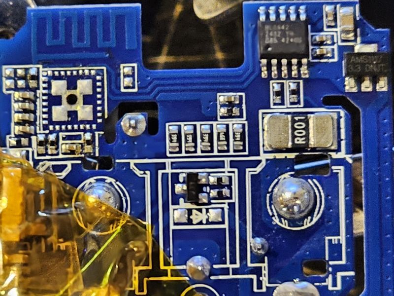 Close-up of PCB with BL0942 Chip Close-up image of a blue PCB with a BL0942 chip and other electronic components.