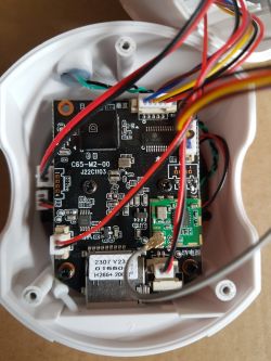 Interior of an IP Camera with Electronic Modules View of the interior of an IP camera with visible main circuit board and wiring.