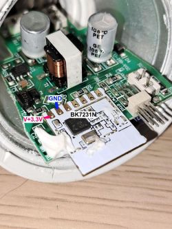 Close-up of the inside of a smart bulb, showing a PCB with the label BK7231N.