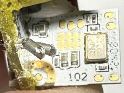 Close-up of the interior of an LED bulb with visible electronic components.