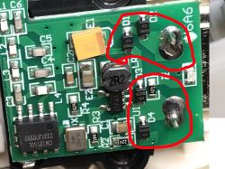 Close-up of PCB with marked coils and rectifier bridge.