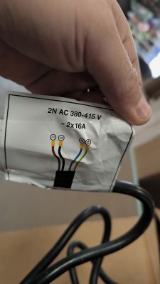 Induction cooktop cable with markings for two-phase connection.