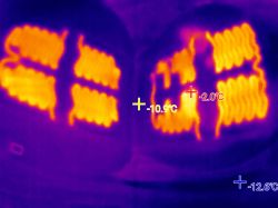 Thermal image of two car seats with visible heating pad patterns.