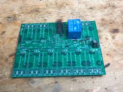 Printed circuit board with relay components on a workbench