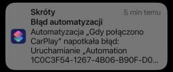 Powiadomienie o błędzie automatyzacji w aplikacji Skróty na iOS, związane z CarPlay.