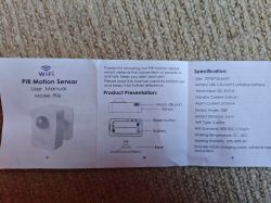 User manual for PIR motion sensor WiFi model P06 lying on a carpet.