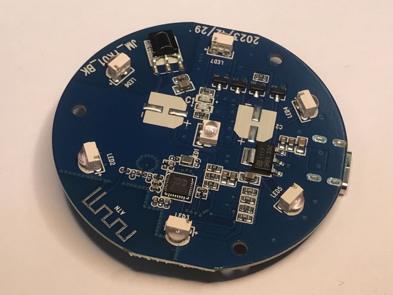 Round PCB with BK7231N chip, IR LEDs, and Wi-Fi antenna trace visible.