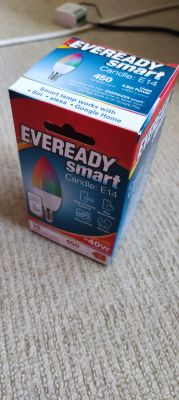 Packaging of Eveready E14 smart bulb on a carpet.