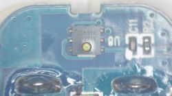 Microscopic close-up of CH8310 chip on a blue PCB