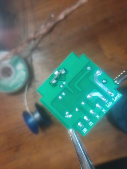 Image of a printed circuit board with wires and electronic components.