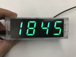 Green 7-segment display in a clear case showing “1845”