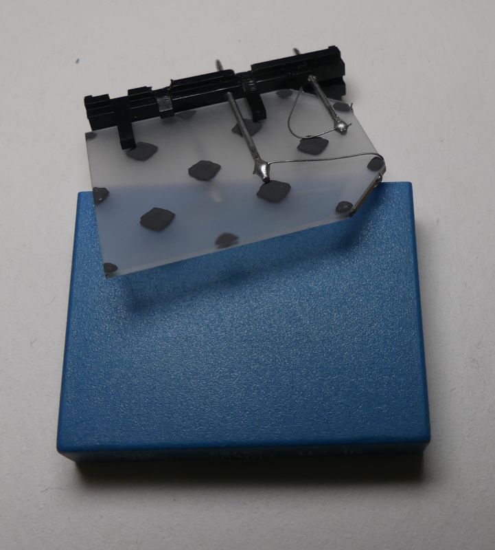 Sensor prototype with metal wires on transparent board with black dots