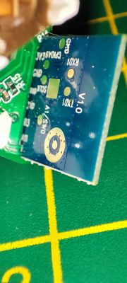 Close-up of PCB with RX0, TX0, and GND Ports Close-up of a PCB with markings for RX0, TX0, GND, and other ports.