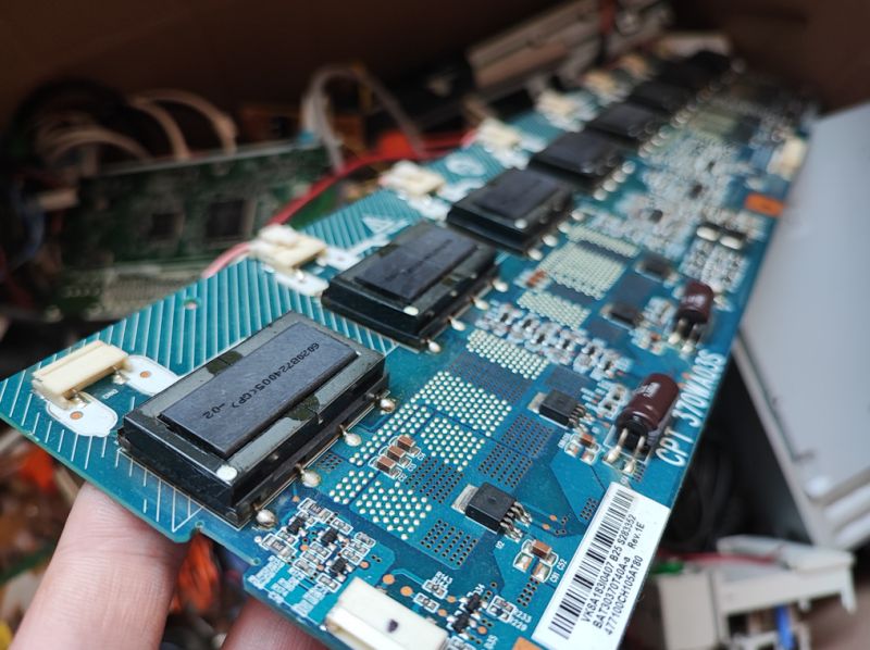 Circuit Board with Transistors and Capacitors Circuit board with electronic components including capacitors and transistors.