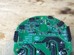 PCB of Avatto Triple Light Switch Close-up of a green PCB with various electronic components.