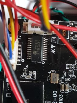 IP Camera's Main Circuit Board Close-up of a camera's main circuit board with wires.