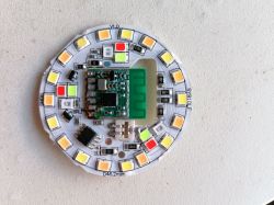 Close-up of a circuit board with LED lights and a chip.