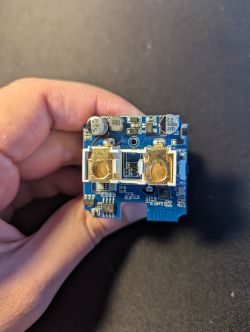 Printed Circuit Board in Hand A printed circuit board with electronic components held in a hand.