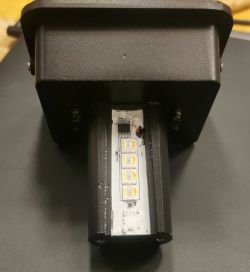 View of a disassembled smart lamp with visible LED diodes and electronic components.