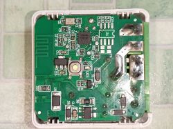 Close-up of a PCB with SMD components and a printed antenna on a Wi-Fi module