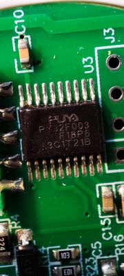 Close-up of Puya PY32F003 microchip on a circuit board.