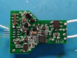 Close-up of a green PCB populated with various electronic components