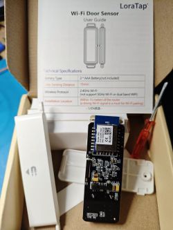 LoraTap Wi-Fi Door Sensor Kit LoraTap Wi-Fi door sensor kit with user manual and components.