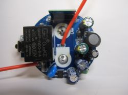 Circuit Board with GuoKE Relay The photo shows a circuit board with various electronic components, including a GuoKE relay and capacitors.