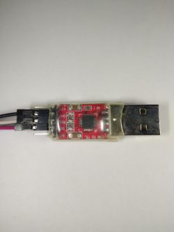 USB to TTL converter with black wires on the left side.
